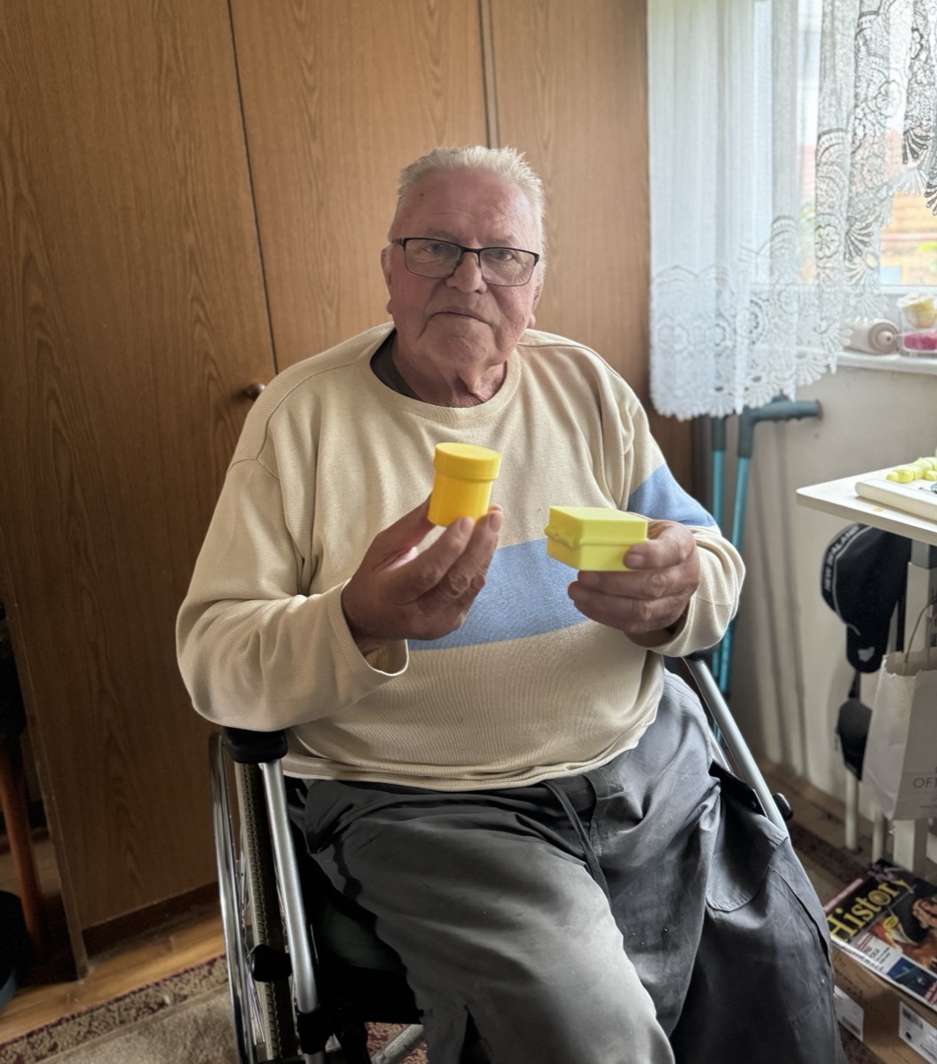 Grandpa showing his handmade products