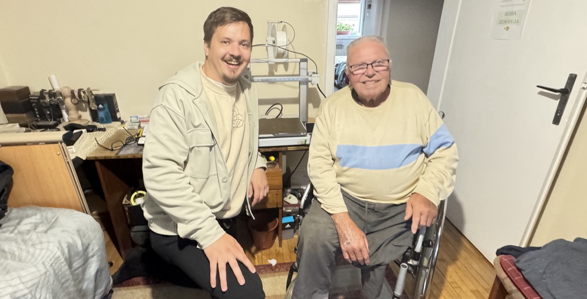 Grandpa with grandson and new 3D printer